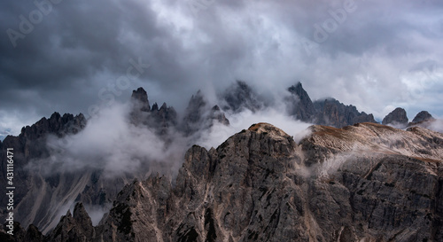 Mountain landscape with mist, at sunset. at Tre Cime di lavaredo, Italian dol...