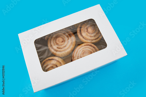 Box with some delicious cinnamon rolls