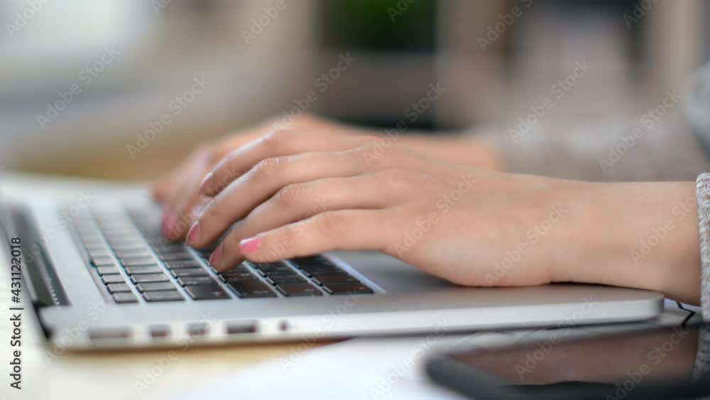 Closeup female hands typing on notebook keyboard. Business user working chatting surfing internet Closeup female hands typing on notebook keyboard. Business user working chatting surfing internet