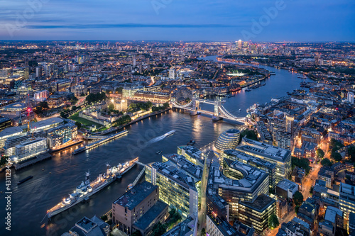 Aerial view of London at night with Thames River and Tower Bridge photo