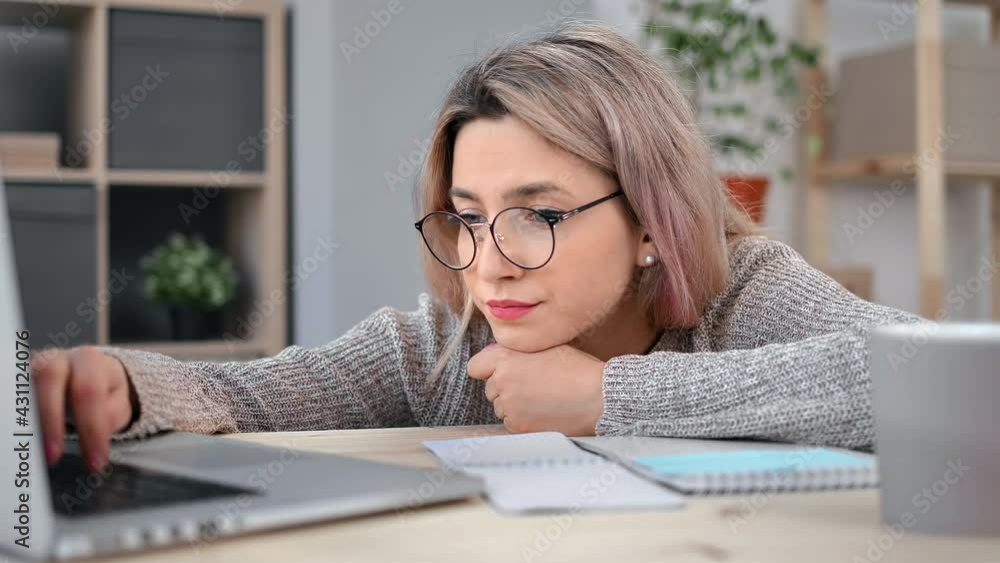 Depressive female office worker lazy typing use laptop lying on desk feeling tiredness overworked Depressive female office worker lazy typing use laptop lying on desk feeling tiredness overworked
