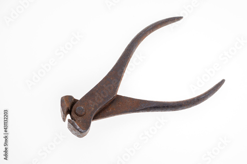 Old rusty pliers isolated on white background