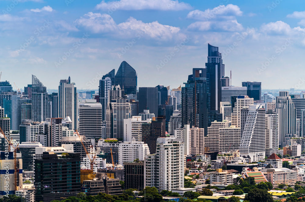 Modern building / skyscraper business zone of cityscape Bangkok skyline with sunny blue sky background, Thailand.