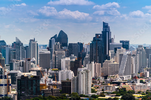 Modern building / skyscraper business zone of cityscape Bangkok skyline with sunny blue sky background, Thailand.