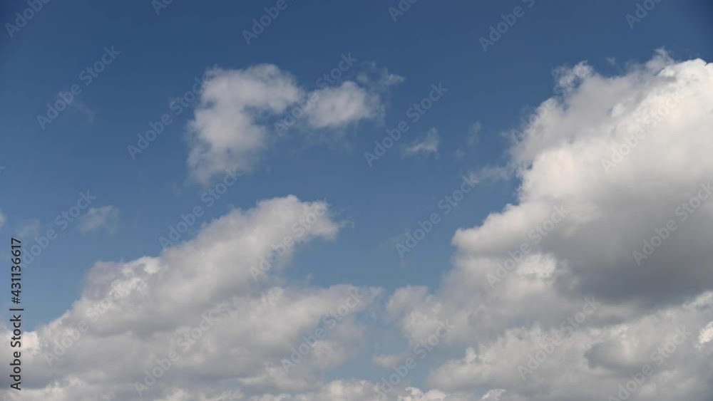 Timelapse sky fluffy white clouds. slow moving clouds on a blue background. Video Background of the movement of air masses across the sky. Universal b-roll Timelapse sky fluffy white clouds. slow moving clouds on a blue background. Video Background of the movement of air masses across the sky. Universal b-roll
