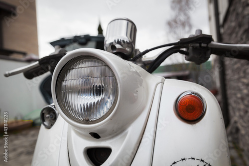 Bild auf Leinwand Old vintage scooter close-up. Old vintage moped close-up.
