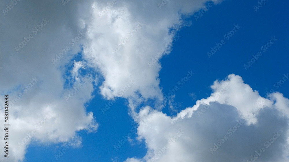 Powerful looking clouds against a bright blue sky Powerful looking clouds against a bright blue sky