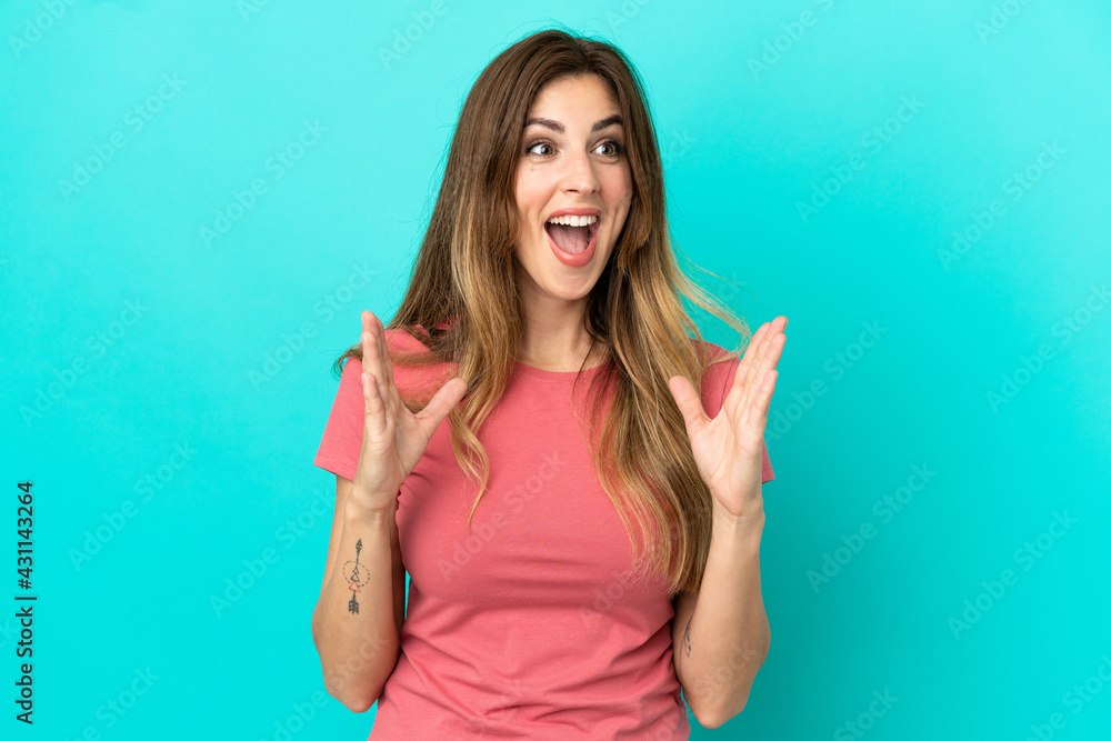 Young caucasian woman isolated on blue background with surprise facial expression Young caucasian woman isolated on blue background with surprise facial expression