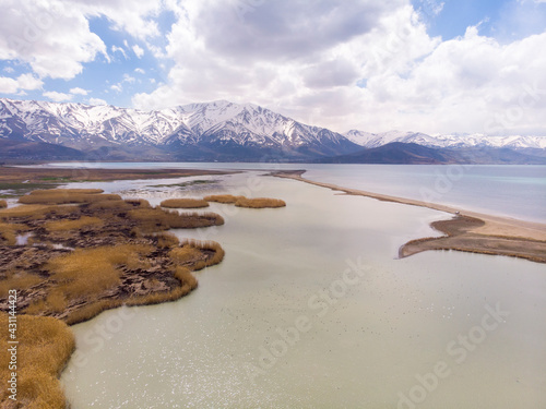 Aerial view of Highland Floodplains where Donemec River connecting to Lake Van surrounded with Mountains and Creating Thin Sandy Spit. Van is the largest lake in Turkey