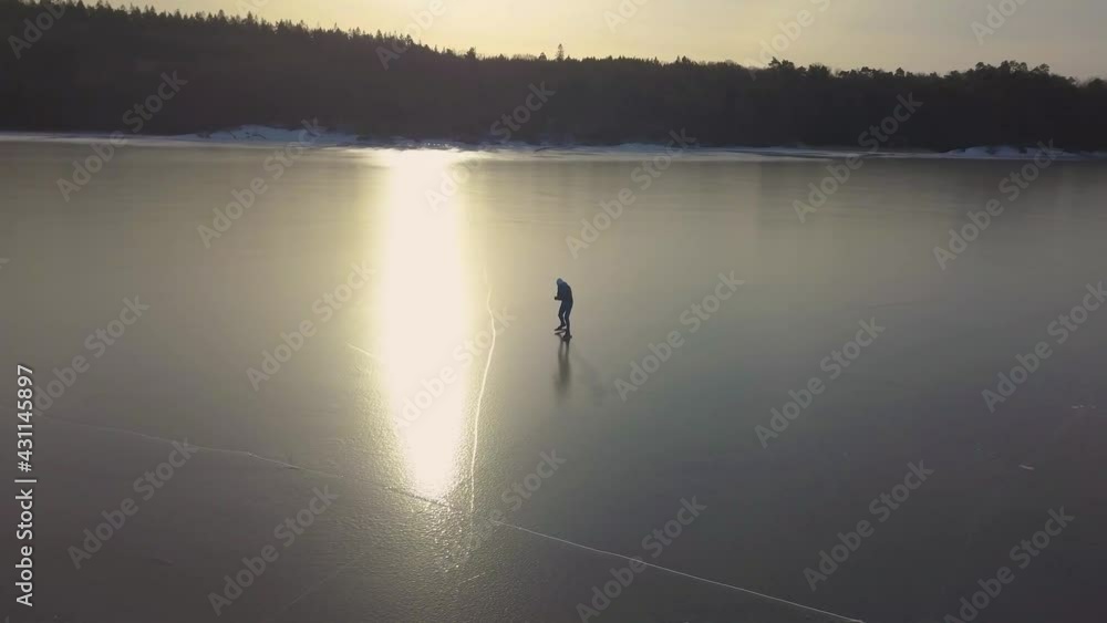 Drone track and circle an iceskater in sunset. Drone track and circle an iceskater in sunset.