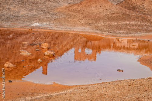 Reflections in the mineralized waters of the Abandoned Mines of Mazarrón. Murcia region. Spain photo