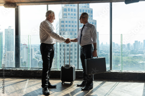 фотографія Two business man shaking hand after their agreement