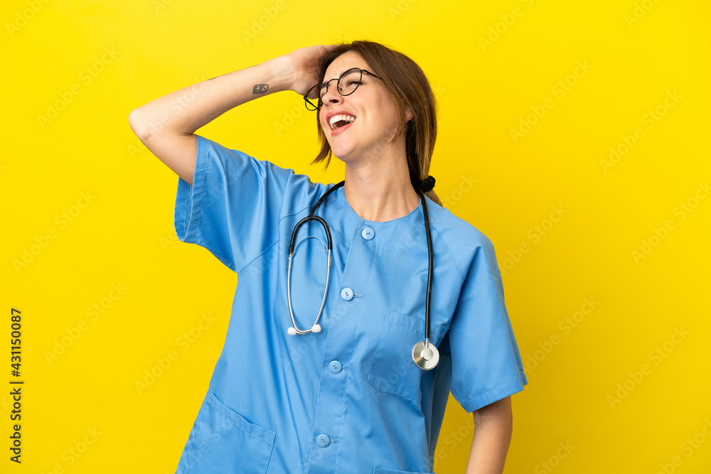 Surgeon doctor woman isolated on yellow background has realized something and intending the solution Surgeon doctor woman isolated on yellow background has realized something and intending the solution