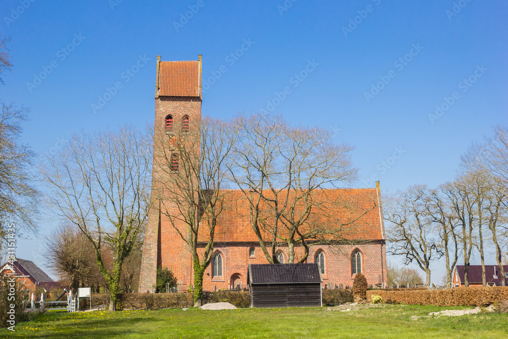 Historic church with leaning tower in Midwolde