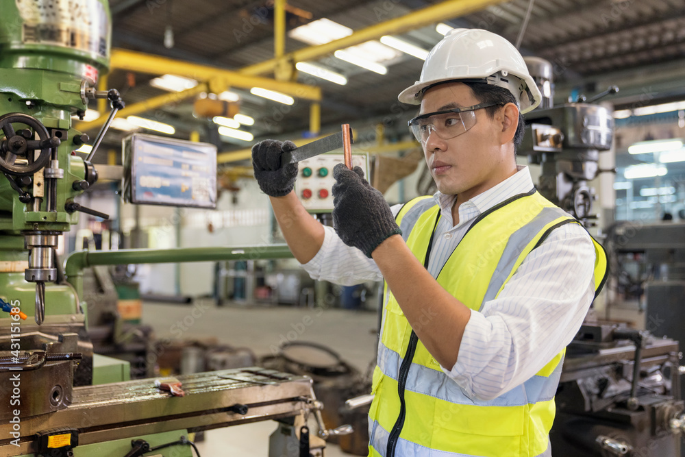 Engineers are working and repairing machines in industrial. Technician holding Measuring pliers. Scale Metal Vernier caliper measuring. Engineers are working and repairing machines in industrial. Technician holding Measuring pliers. Scale Metal Vernier caliper measuring.