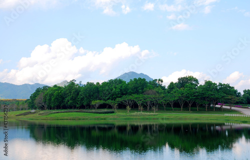 Tranquil scene Landscape of lake with mountain background and reflection of mountain and cloud sky in the lake at singha park chiang rai thailand 