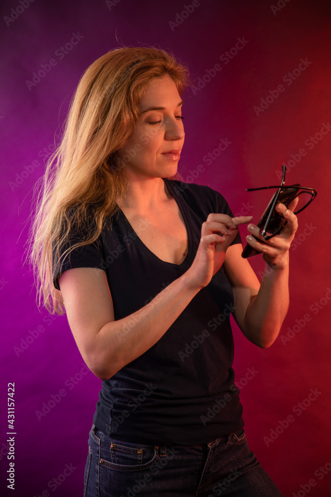 young woman with the cell phone and eyeglasses young woman with the cell phone and eyeglasses