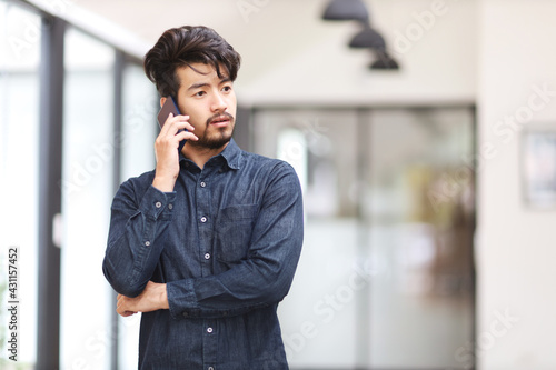 A man asia talking on smart phone