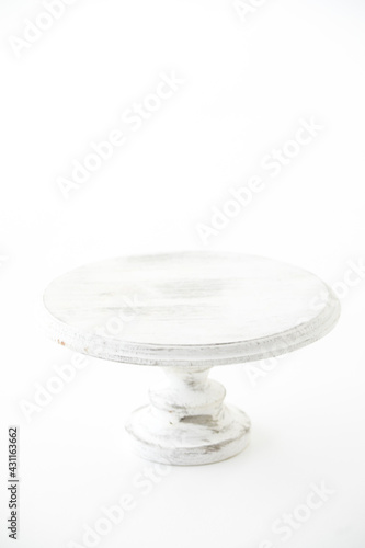 Handmade wooden cake plate. Craft and hobby concept. Object on a white background.
