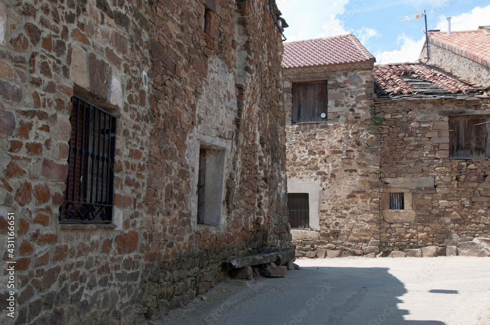Empty street in a rural village. with traditional stone houses. Soria, Castilia, Spain