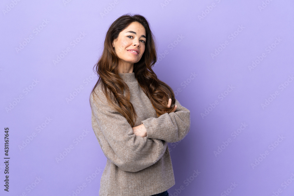 Woman over isolated purple background with arms crossed and happy Woman over isolated purple background with arms crossed and happy