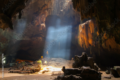 Amazing Buddhism with the ray of light in the Chom Phon cave, Ratchaburi,Thailand