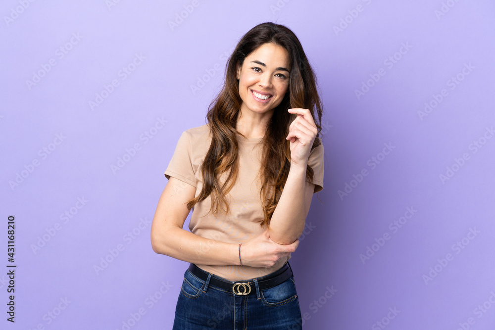 Woman over isolated purple background laughing Woman over isolated purple background laughing