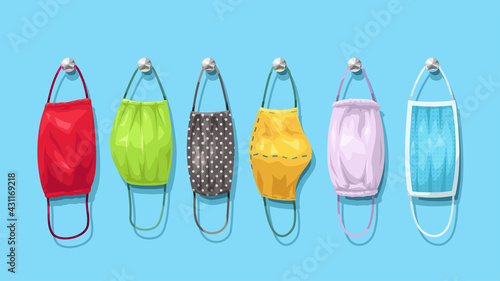 set of different textile face masks hanged