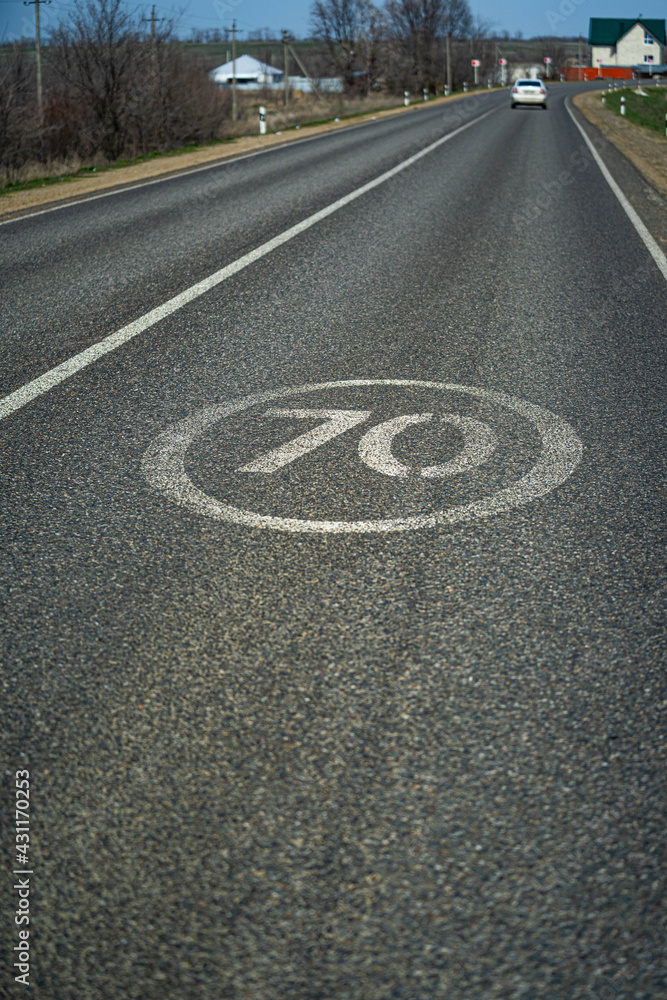 Fototapeta premium road sign end of speed limit 70 kilometers per hour