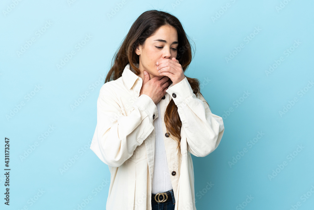 Woman over isolated background coughing a lot