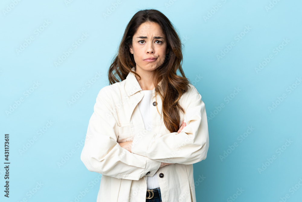 Woman over isolated background feeling upset Woman over isolated background feeling upset