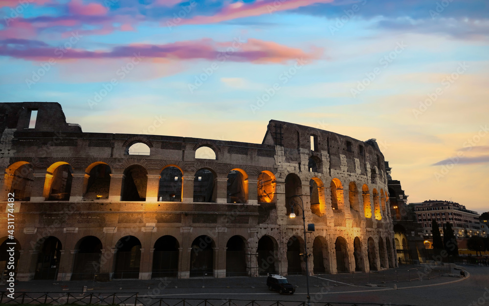 Panoramic view of sunset in Colosseum in Rome, Italy. Rome architecture and landmark. Rome Colosseum is one of the main attractions of Rome and Italy