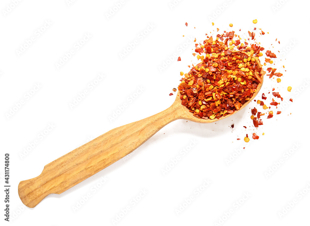 Spoon with red paprika on white background Spoon with red paprika on white background