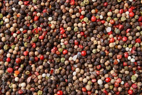 Different peppercorns as background