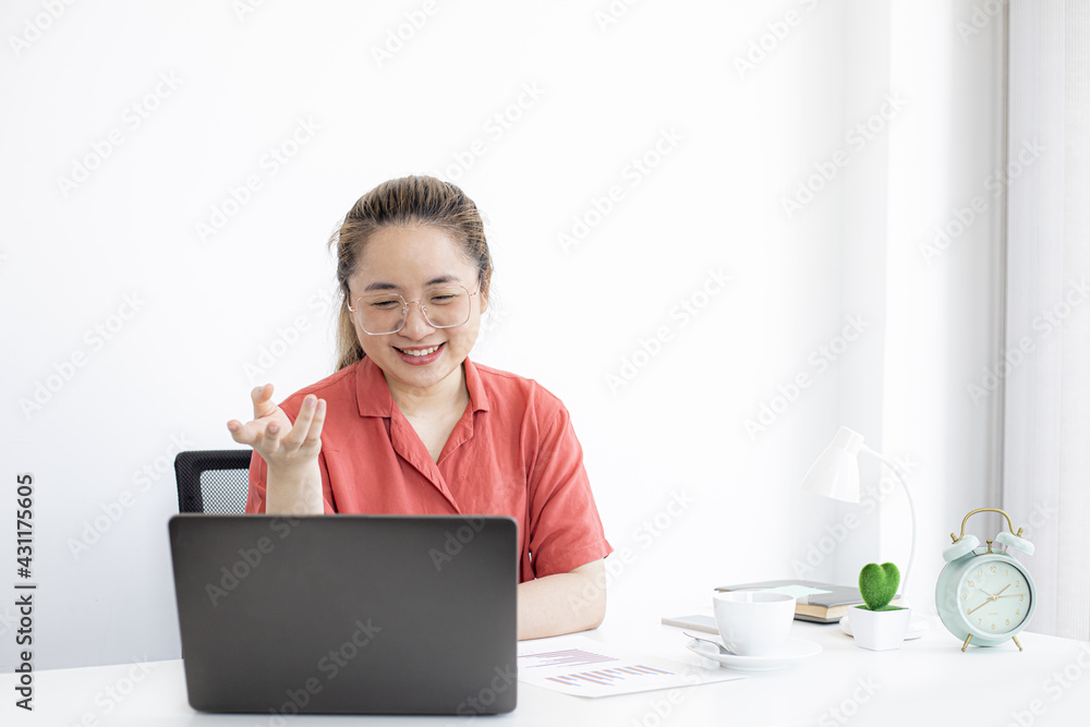 The businesswoman is on a teleconference with her partner and secretary, the company announces that employees work from home to prevent the spread of COVID-19. The idea of working from home. The businesswoman is on a teleconference with her partner and secretary, the company announces that employees work from home to prevent the spread of COVID-19. The idea of working from home.