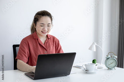 The businesswoman is on a teleconference with her partner and secretary, the company announces that employees work from home to prevent the spread of COVID-19. The idea of working from home.