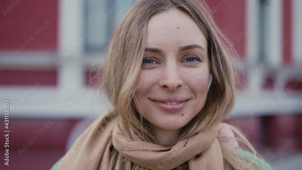 Closeup face of beautiful blonde smiling woman with long hair Closeup face of beautiful blonde smiling woman with long hair