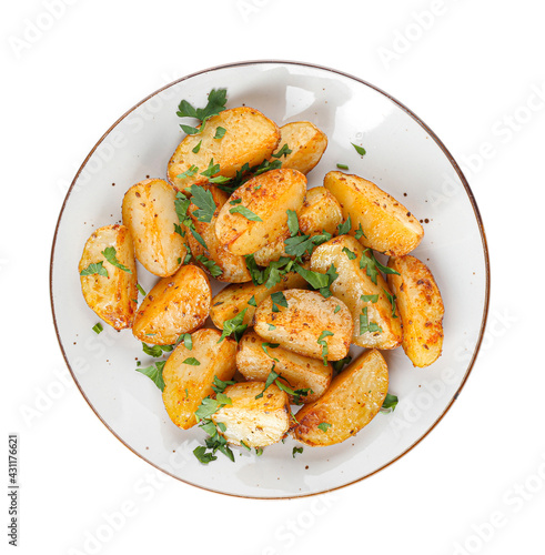 Plate of tasty fried potatoes with parsley on white background