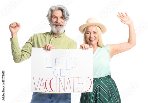 Senior couple holding poste...
