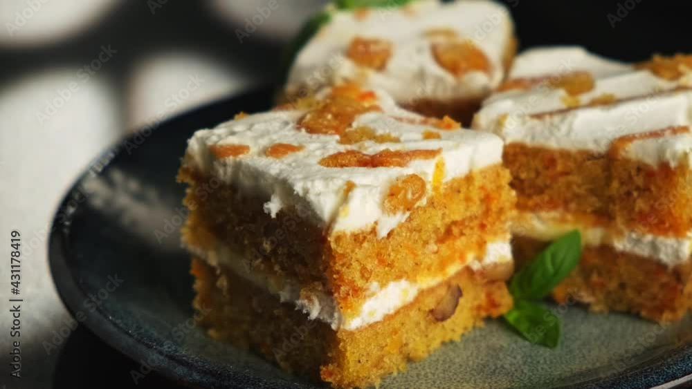 Carrot dessert cake on a plate on a black background. A copyspace. Carrot dessert cake on a plate on a black background. A copyspace.