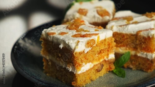 Carrot dessert cake on a plate on a black background. A copyspace.
