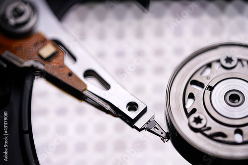 Wallpaper Mural Hard disk spindle and recording head close-up. Computer detail, data recording and information storage. Storage device Torontodigital.ca