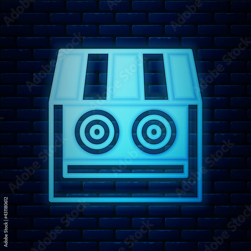 Glowing neon Shooting gallery icon isolated on brick wall background. Shooting range. Vector