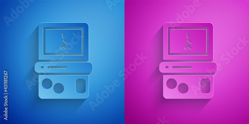 Paper cut Portable tetris electronic game icon isolated on blue and purple background. Vintage style pocket brick game. Interactive playing device. Paper art style. Vector