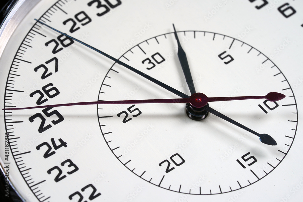 Watch dial with number and running arrow closeup. Clock face, arrow, hand, pointer, cursor