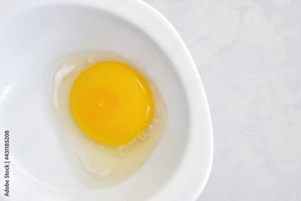egg white and yolk in the plate separated from the shell,v egg white and yolk in the plate separated from the shell,v