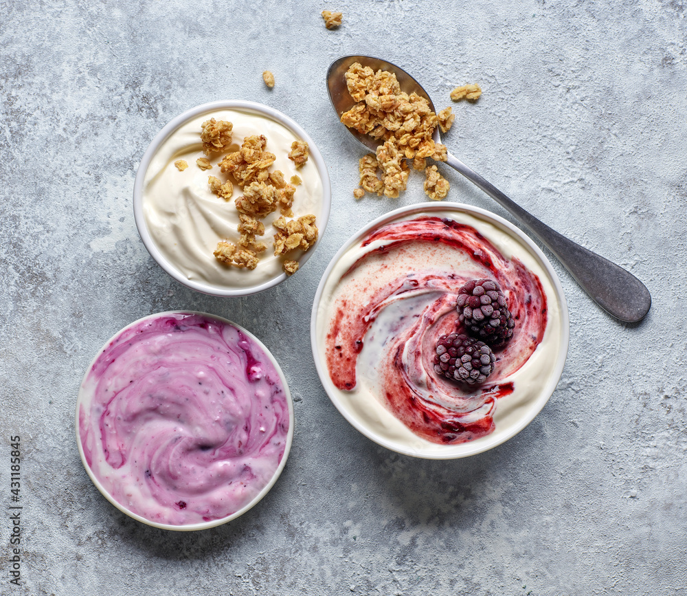 bowls of various greek yogurt bowls of various greek yogurt
