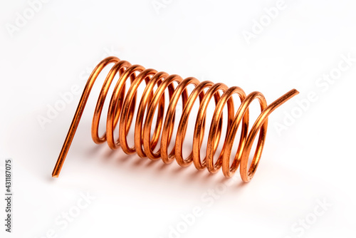 Close-up of copper coils isolated over white background photo