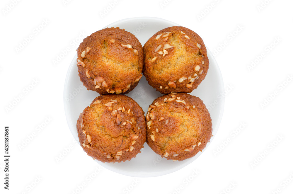 Four pieces of fresh delicious homemade banana cup cake in white dish isolated on white background, ready to serve