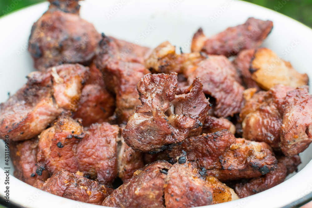 Charcoal grilled pork meat in a plate